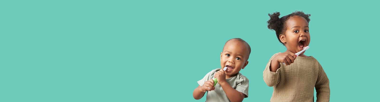 Toddlers brushing their teeth